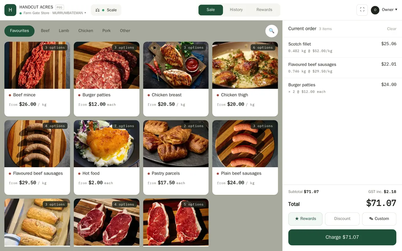 A tablet register: a grid of photographed product tiles priced by the kilo or each, and a running order down the right with a subtotal, the GST included, and a charge button.
